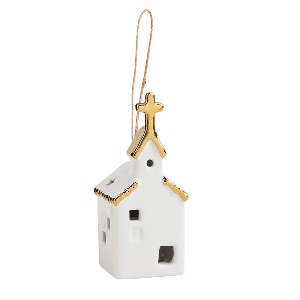 Decorative white church ornament with gold roof on a white background